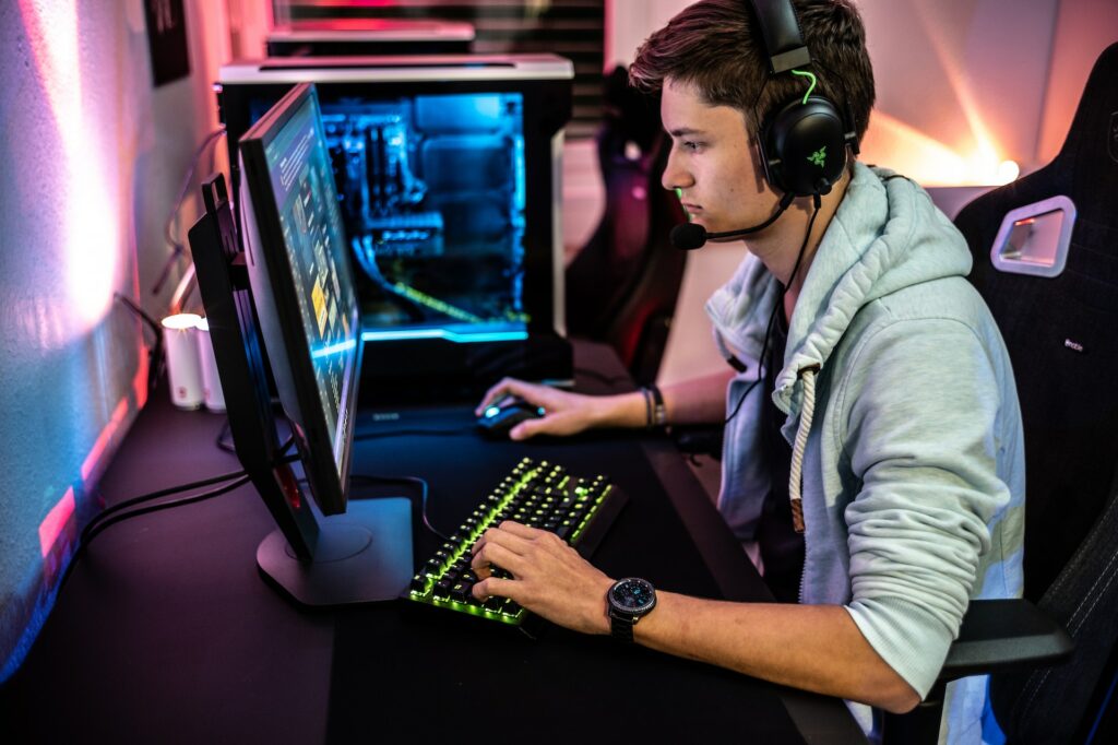 man typing on computer