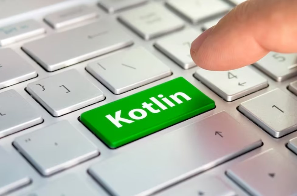 a green keyboard button with the Kotlin lettering on it