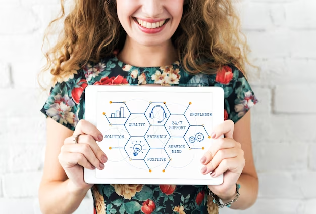 A girl who holds a tablet in her hands on which a diagram is shown